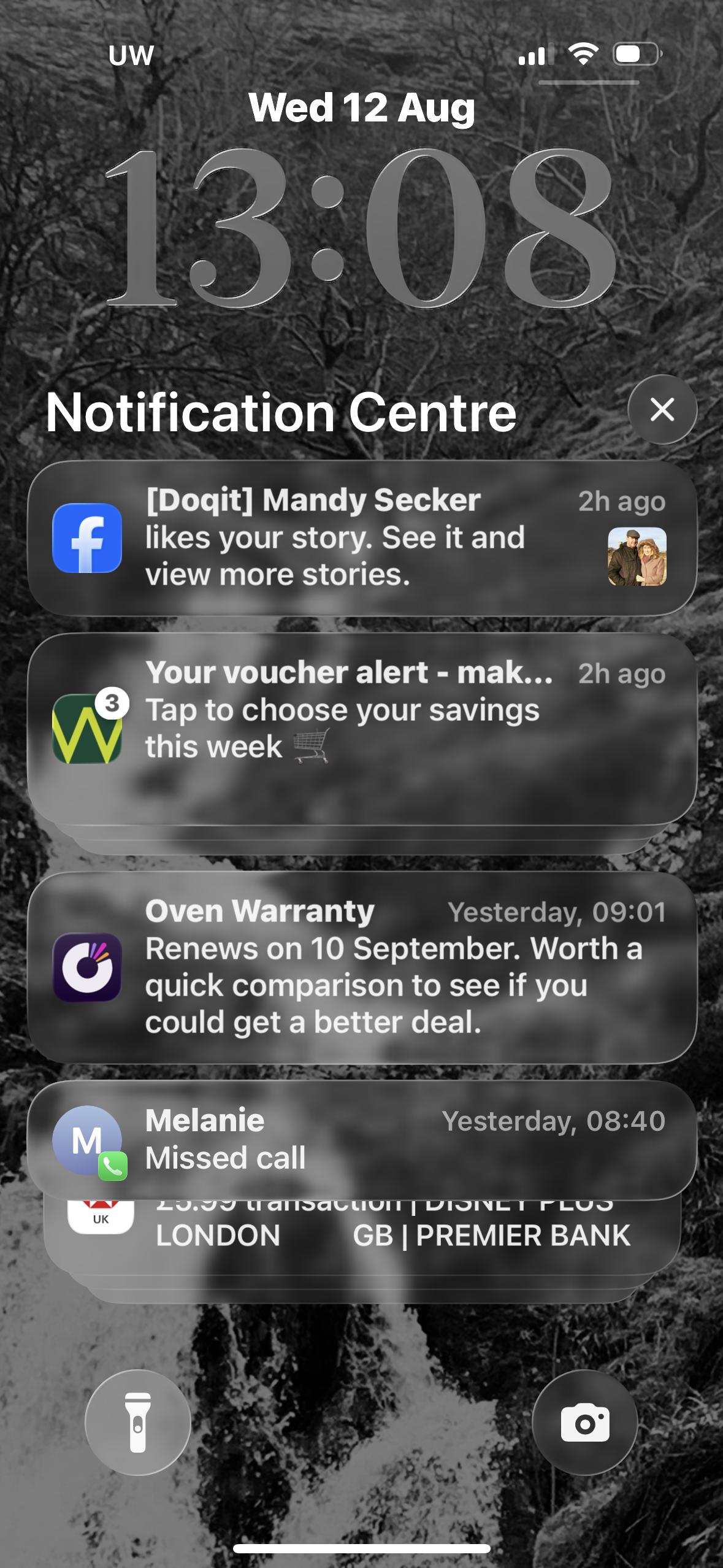 A phone notification centre showing multiple alerts, including a Doqit reminder about an oven warranty renewal.